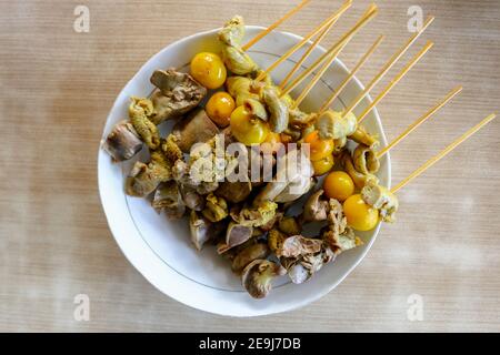 Sate jerohan or innards egg satay. Indonesian traditional food made from eggs and chicken. Stock Photo