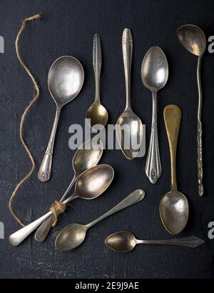 Flat lay. Placed on a black background empty wooden spoon, five pieces Placed on a black background Stock Photo