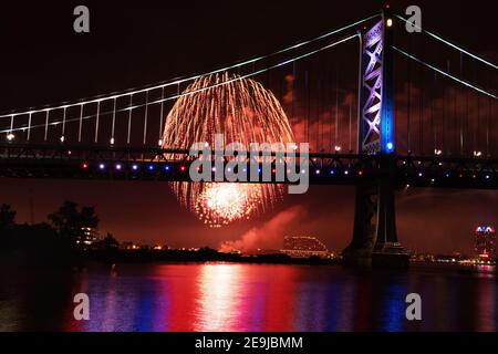 Fireworks Exploding Near Ben Franklin Bridge Philadelphia PA on July 4th. Stock Photo