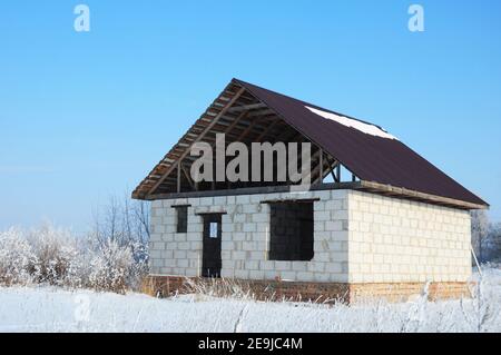 Building Home During Winter. Building a house in the winter. Stock Photo