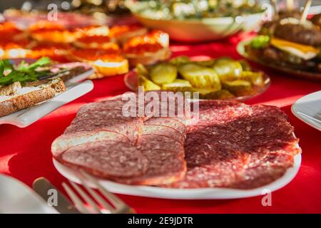Cutting from selected sausages on the festive table Stock Photo