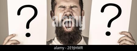 Question mark, symbol. Man screaming, emotion. Man question. Male with emotion scream, question marks. Screaming man. Stock Photo