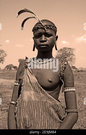 Young Mursi Tribe Woman with Tribal Scarring, Omo Valley, Ethiopia Stock Photo