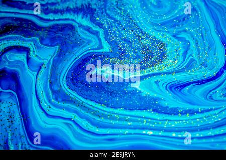 Abstract artwork. Natural Luxury. Marbleized effect. Acrylic paint. Style incorporates the swirls of marble or the ripples of agate for a luxe effect. Stock Photo