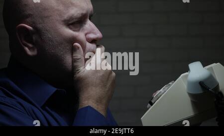 Night Shoot with a Businessman Talking on the Phone in Office Room. Stock Photo