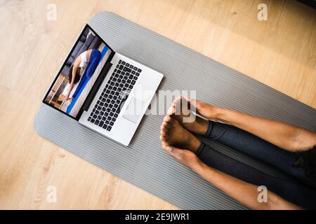 Online Laptop Home Fitness Workout And Exercise Stock Photo