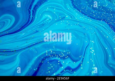 Abstract artwork. Natural Luxury. Marbleized effect. Acrylic paint. Style incorporates the swirls of marble or the ripples of agate for a luxe effect. Stock Photo
