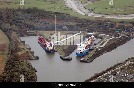 aerial view of two vessels in dock on Manchester Ship Canal at Ellesmere Port. On left: Clyde Fisher (Nassau). On right: Bro Designer (Copenhagen) Stock Photo