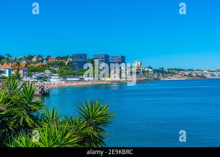 Palace of duques of palmela viewed behind Duquesa beach in Cascais, Portugal Stock Photo