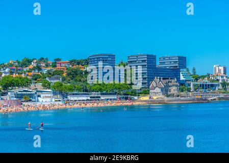 Palace of duques of palmela viewed behind Duquesa beach in Cascais, Portugal Stock Photo