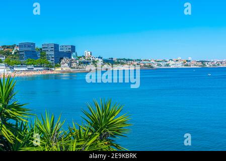 Palace of duques of palmela viewed behind Duquesa beach in Cascais, Portugal Stock Photo