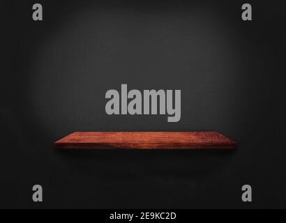 Blank of old wooden shelf on dark wall texture background with clipping path for design Stock Photo