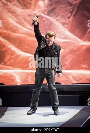 Bono from U2 performs Joshua Tree live on stage at Twickenham Stadium, Twickenham, London. Stock Photo