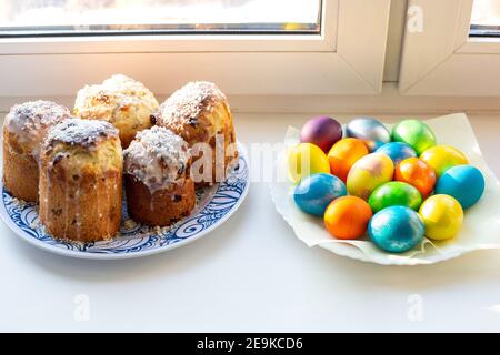 colored multi-colored homemade eggs and cakes for Easter, celebration of the great holiday Stock Photo