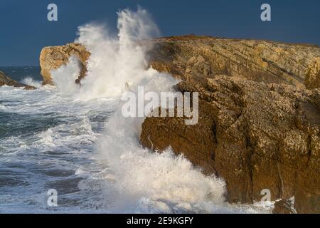 Swell and storm in the Hermitage of the Virgen del Mar in San Roman de la Llanilla in the Municipality of Santander. Virgen del Mar Island in the Cant Stock Photo