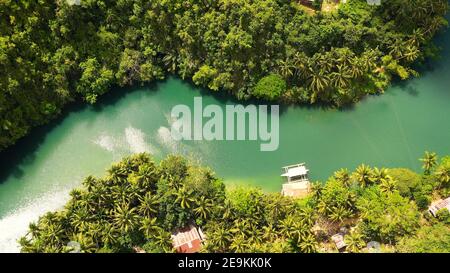 Beautiful natural scenery of Loboc river in tropical green forest ...