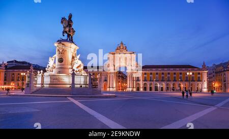 Commerce Square or Praça do Comércio at night. Statue of Dom José I, King on horse is symbolically crushing snakes on his path. Arco da Rua Augusta. Stock Photo