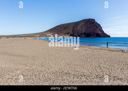 Red mountain, Montana roja, and Playa de Tejita beach with sunbathers, in Tenerife, Canary Islands, Spain Stock Photo