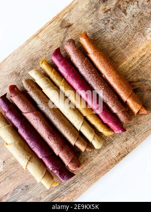 Fruit leather roll, pastille isolated on white background. Healthy snack food, natural nutrition for kids Stock Photo