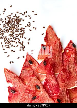 Dried watermelon and melon chips homemade sweet healthy dessert isolated on white. Stock Photo