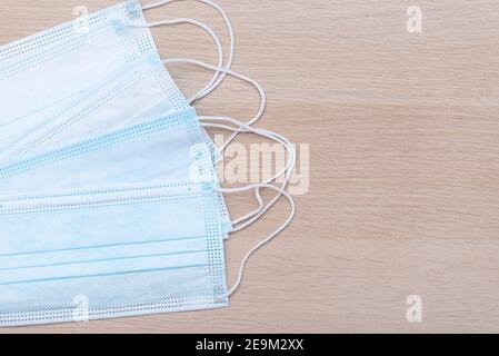 Protective medical masks on the table, top view, medical theme Stock Photo