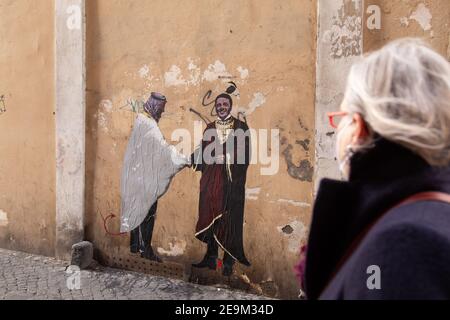 Roma, Italy. 04th Feb, 2021. A new mural by Italian streetartist Harry Greb in Rome portrays the leader of Italia Viva Matteo Renzi with Saudi prince Mohammed Bin Salman shaking hands (Photo by Matteo Nardone/Pacific Press/Sipa USA) Credit: Sipa USA/Alamy Live News Stock Photo