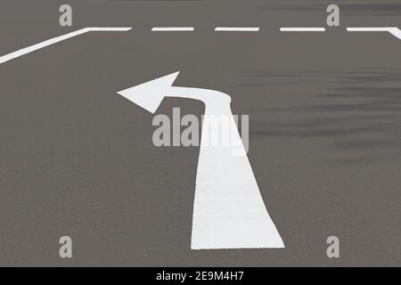 Road with turn left arrow Stock Photo