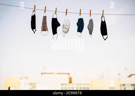 Washable protective face masks drying up on the rope Stock Photo