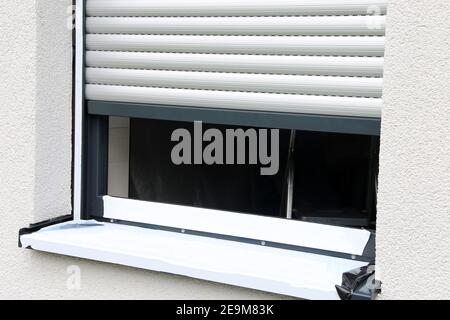 Newly installed window with roller shutter Stock Photo