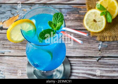 Blue Lagoon cocktail of blue curacao syrup mixed with vodka and lemonade Stock Photo