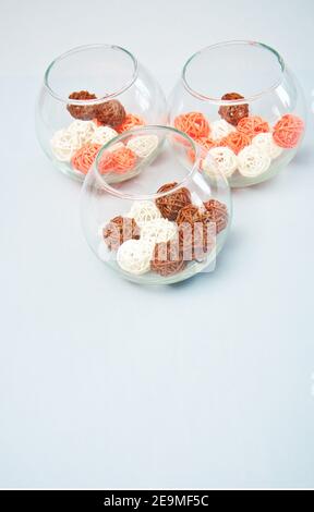 3 glasses with small basket balls on isolated white background. Stock Photo