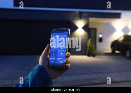 Smart home control with smartphone (editorial) Stock Photo