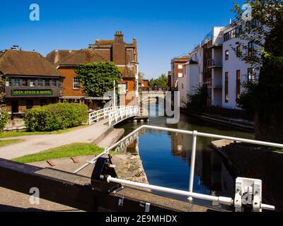 Newbury in Berkshire, England as viewed from the lock gates at West Mills showing the bridge over the Kennet and Avon canal in the centre of town. Stock Photo