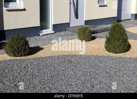Modern house and front yard with stone pillars Stock Photo - Alamy
