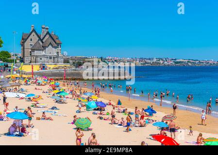 CASCAIS, PORTUGAL, MAY 31, 2019: Palace of duques of palmela viewed behind Duquesa beach in Cascais, Portugal Stock Photo