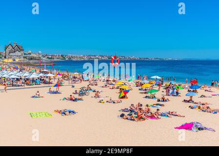 CASCAIS, PORTUGAL, MAY 31, 2019: Palace of duques of palmela viewed behind Duquesa beach in Cascais, Portugal Stock Photo