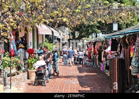 LOS ANGELES, USA - APRIL 5, 2014: People visit Olvera Street market in Los Angeles. Olvera Street is the oldest part of downtown LA. It is California Stock Photo