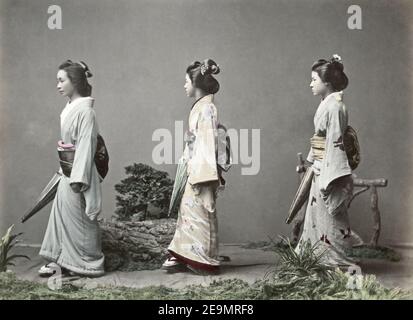 Late 19th century photograph - Geishas with parasols and obi sashes, Japan Stock Photo