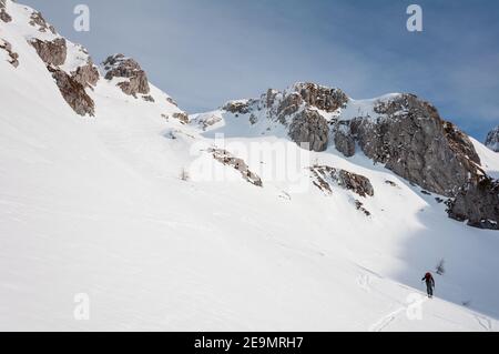 climbing up to Antander Fork. Ski touring in Alpago mountain range. January 2009. Stock Photo