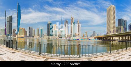Dubai - The panorama with the bridge over the new Canal and Downtown.
