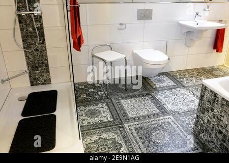 Modern bathroom with floor tyles in vintage look Stock Photo