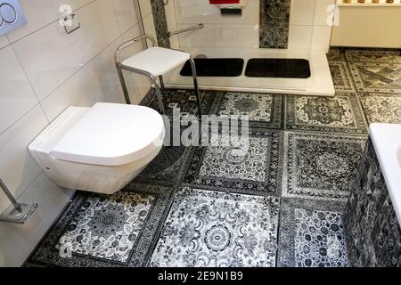 Modern bathroom with floor tyles in vintage look Stock Photo