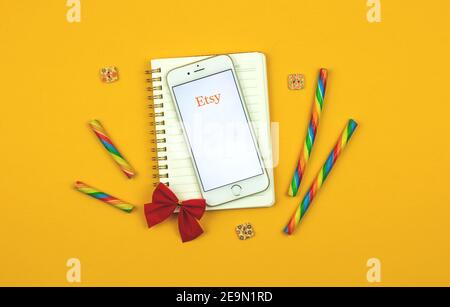 Kharkov, Ukraine - February 5, 2021: creative background of Etsy application on Apple smartphone,e-commerce site of handmade products, logo and icon, Stock Photo