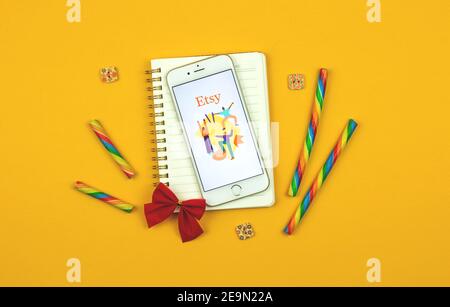 Kharkov, Ukraine - February 5, 2021: creative background of Etsy application on Apple smartphone,e-commerce site of handmade products, logo and icon, Stock Photo