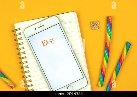 Kharkov, Ukraine - February 5, 2021: close up of Etsy application on Apple smartphone, e-commerce site of handmade products, logo and icon, flat lay Stock Photo