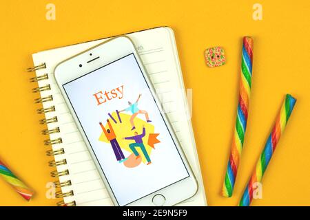 Kharkov, Ukraine - February 5, 2021: close up of Etsy application on Apple smartphone, e-commerce site of handmade products, logo and icon, flat lay Stock Photo