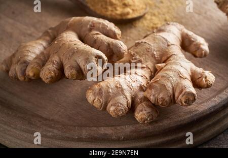 Ginger root on a wooden cutting board Stock Photo