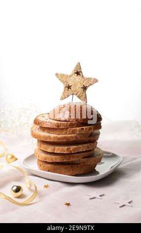 Italian food concept. Christmas gourmet panettone isolated on white background. Christmas decorations. Stock Photo