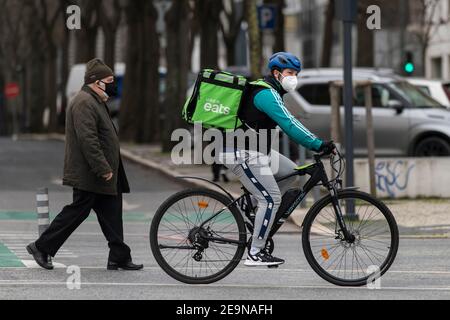 A Uber Eats courier wearing a face mask as a precaution against the