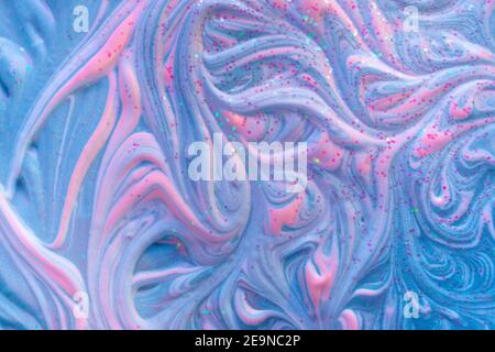 Liquid marble fluid art texture. Light trendy modern background at blue and creamy pink ink colors. Volume inkscape relief with acrylic foam and glitt Stock Photo